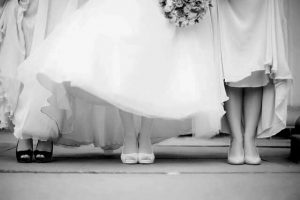 black and white wedding photo of women feet