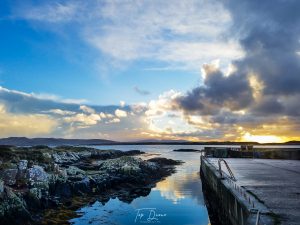 Burtonport Pier sunset reflecting on water