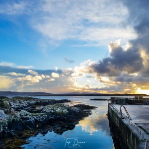 Burtonport Pier sunset reflecting on water