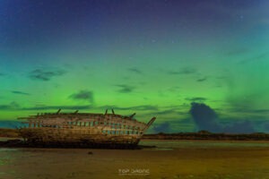 Northern lights illuminating Bad Eddie in Bunbeg