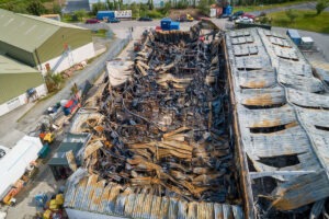 fire investingation drone photo showing damage to tool hire shop